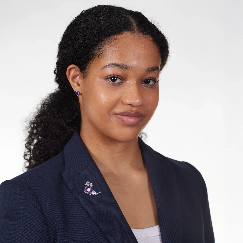 Model wearing Pearl Poppy Brooch